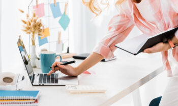 A female blogger working from home on her laptop
