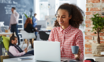 Woman working in a coworking space hoping to tap into her creativity